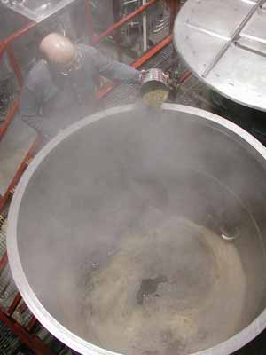 [View of Dan adding aroma hops to whirl